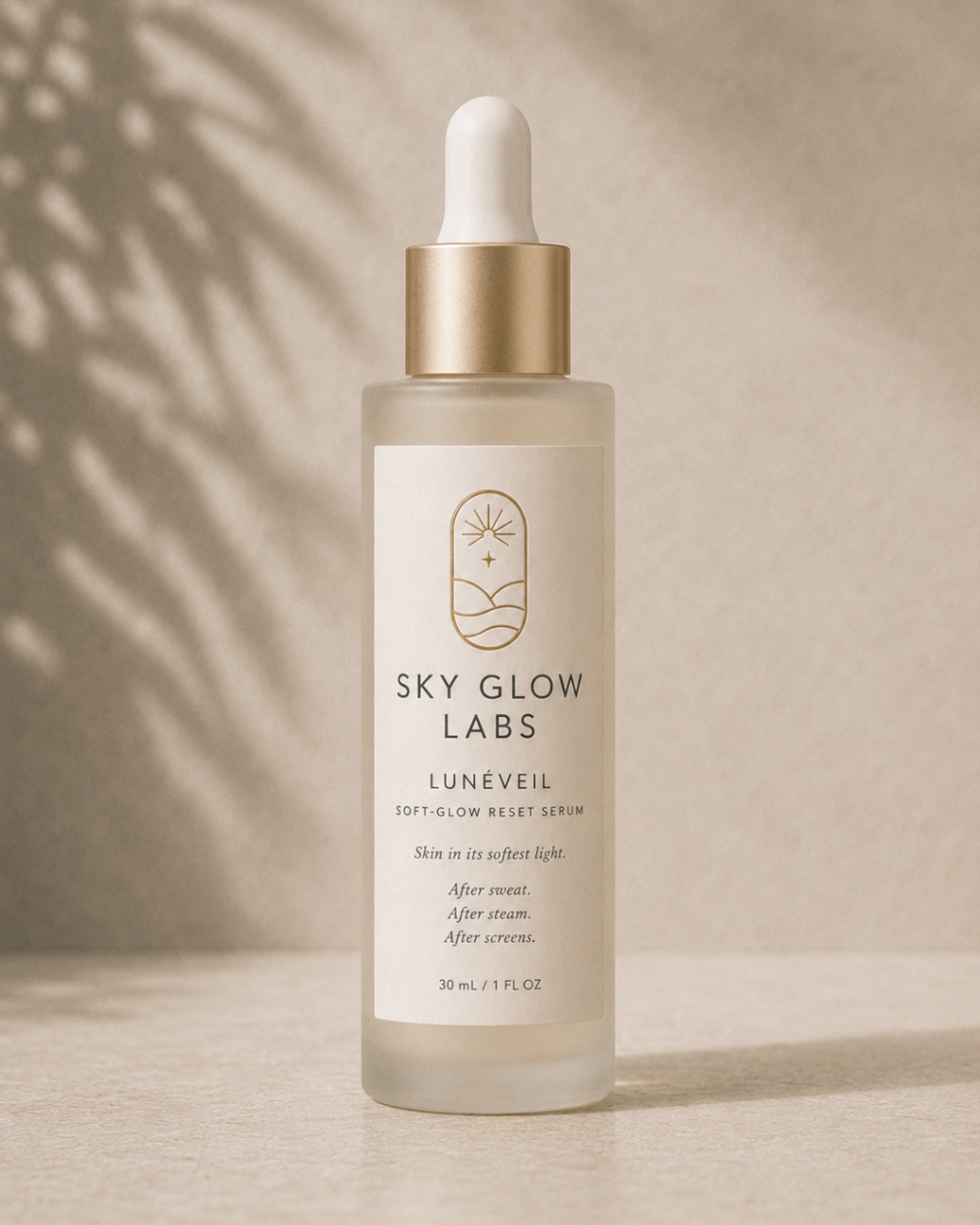 Lunéveil Soft-Glow Reset Serum bottle in frosted glass with champagne collar